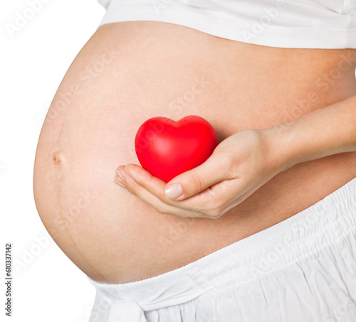 Wallpaper Mural Pregnant mother showing her belly and holding a mini heart Torontodigital.ca