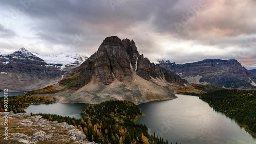 Beautiful view of Nublet Peak with Mount Assiniboine and lake in autumn forest at the evening photo