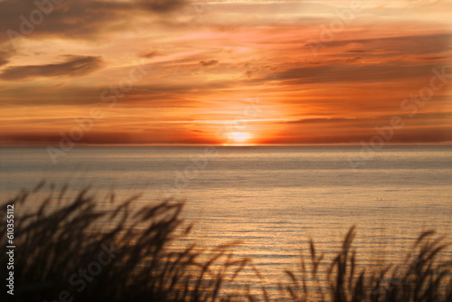 Colorful sunrise in the horizon on an calm ocean