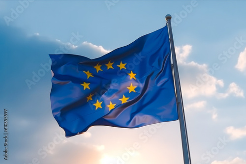 Flag of the European Union on flag pole fluttering in the wind with bright blue sky and light clouds in the background. Generative AI.