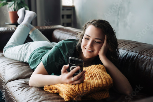 Technology and Youth: Home-Based Student Engaging in Mobile Texting and Study - Online Communication, Remote Learning, and Modern Lifestyle Concept.