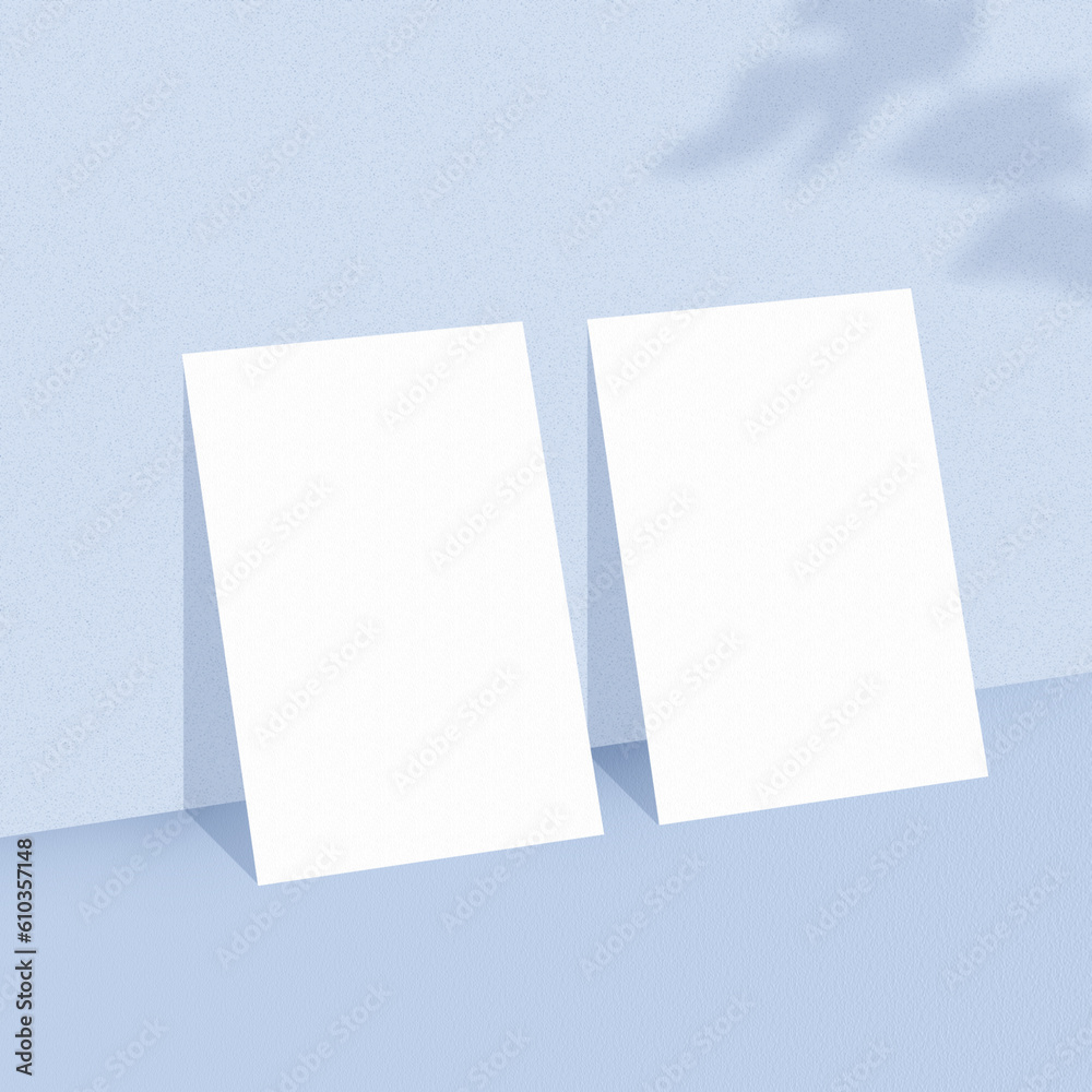 Two empty white paper sheets on light blue background with shadow overlay. The papers mock-up. Two empty white paper sheets on light blue background with shadow overlay. The papers mock-up.