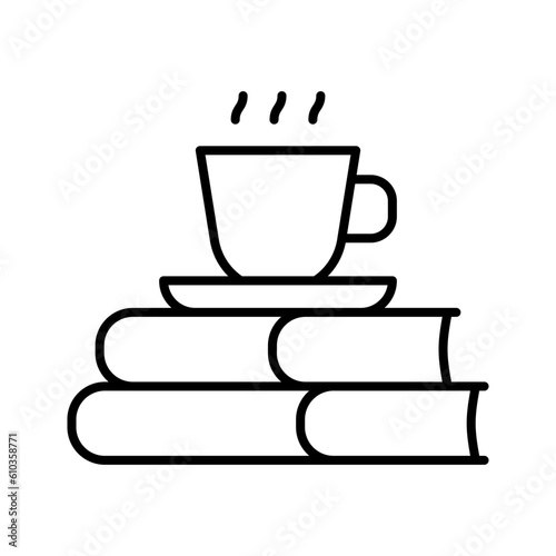 Stack of books and mug. Coffee cup on stack of books isolated white background.
