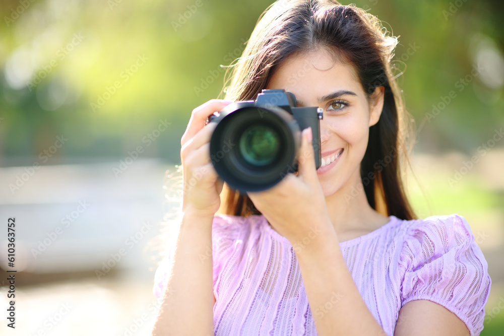 Happy photographer taking picture of you