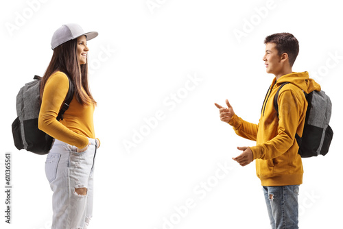 Profile shot of a male teenager talking to a female student