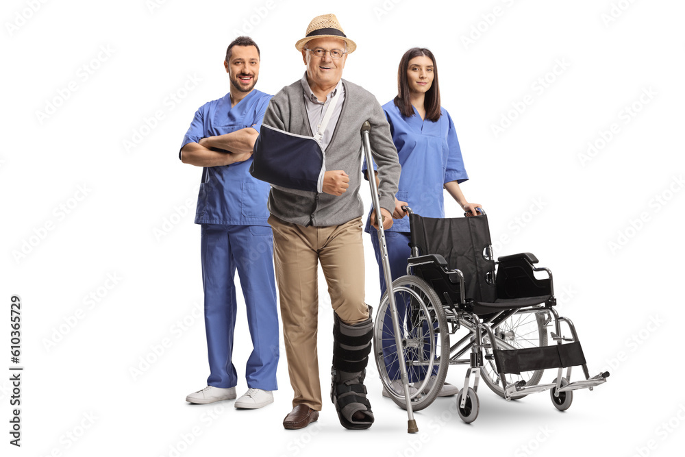 Team of medical workers behind a senior patient with a broken arm Team of medical workers behind a senior patient with a broken arm