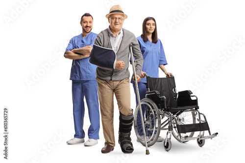 Team of medical workers behind a senior patient with a broken arm © Ljupco Smokovski