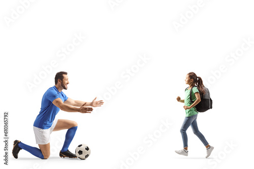 Female pupil running towards a football player