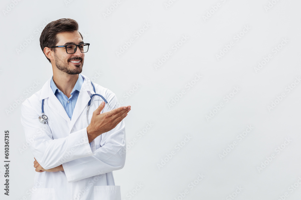 Man doctor in white coat and eyeglasses smile shows hand gestures signs on white isolated background looks into camera, copy space, space for text, health Man doctor in white coat and eyeglasses smile shows hand gestures signs on white isolated background looks into camera, copy space, space for text, health