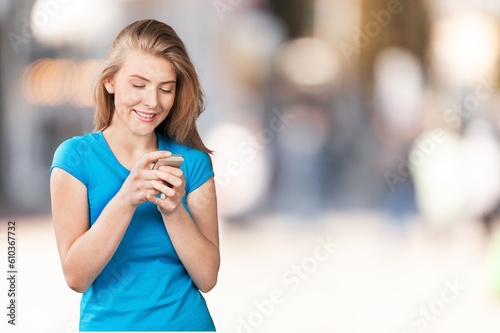 Young adult happy woman holding phone