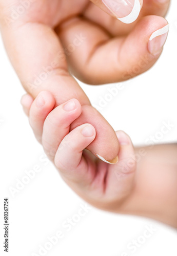 Baby's hand holds a mother fingers