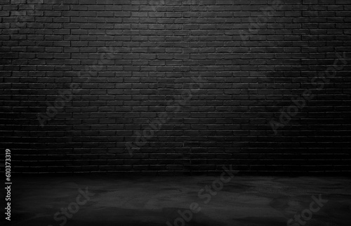 industrial background for product displayed. black brick wall background, rough concrete, plastered concrete floor, with lights from above. lighting effect on empty brick wall background for design.