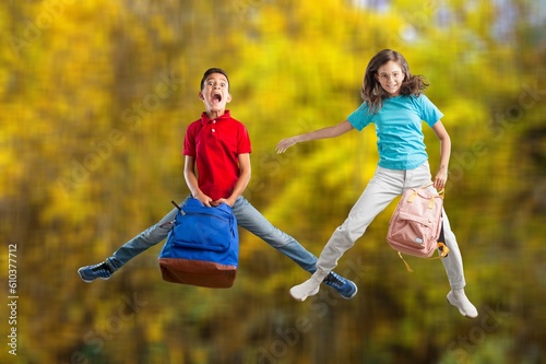 Happy young Children Jumping on forest background