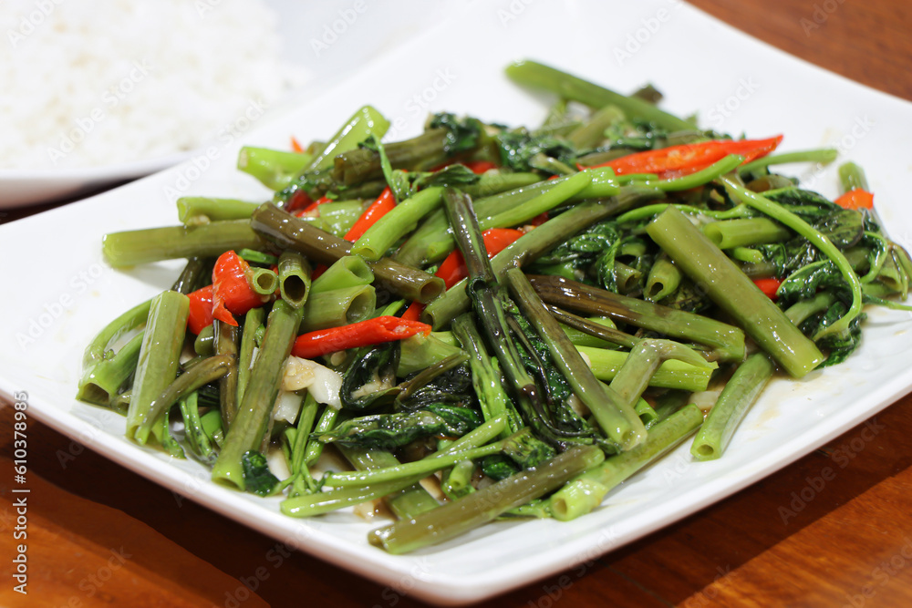 Stir-Fried Chinese Morning Glory or Water Spinach - Asian food style Stir-Fried Chinese Morning Glory or Water Spinach - Asian food style