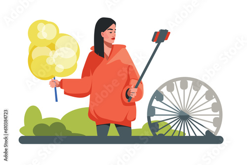 Girl keeps blog about her life, takes pictures of herself from monopod. Female character walks through park. Blogger eats cotton candy, reviews attractions and carousels. Video advertising of park