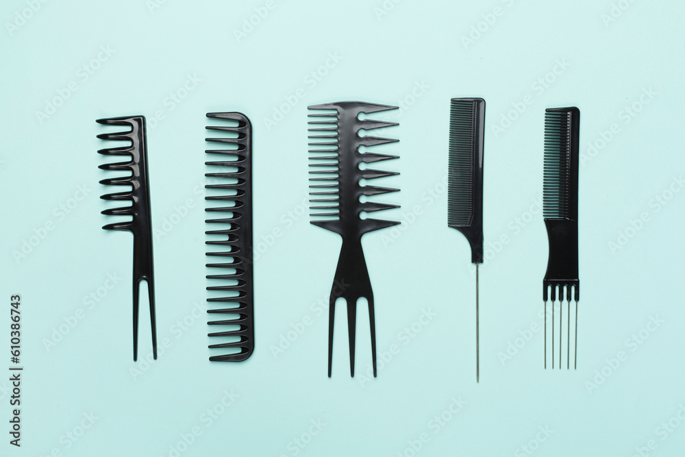 Professional combs and hairdresser tools on color background, top view Professional combs and hairdresser tools on color background, top view