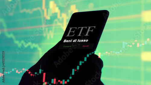 March 07th 2023 Italia, An investor analyzing an etf fund on a phone. Italian text: Luxury goods, buy, sell. photo