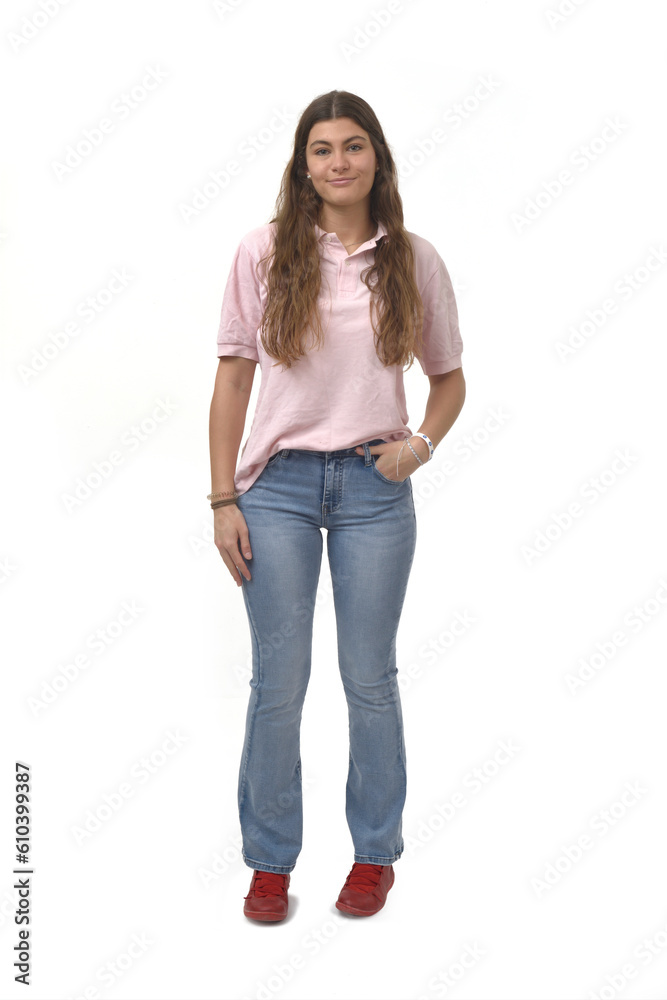 front view of a young girl standing with hands on pockets on white background front view of a young girl standing with hands on pockets on white background