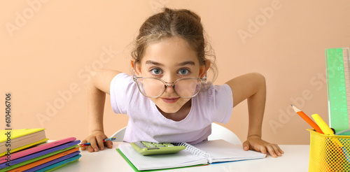 Clever little girl doing ho...