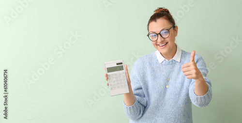 Portrait of woman with calc...