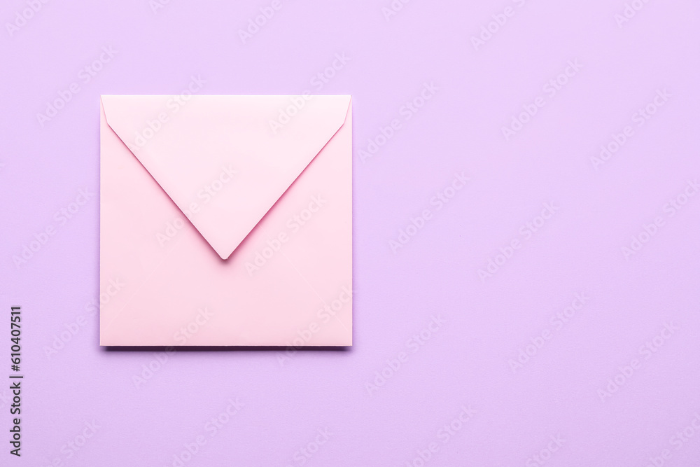 Pink envelope on lilac background. Message concept Pink envelope on lilac background. Message concept