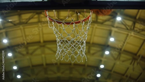 Basketball Goes Through Hoop In Gym