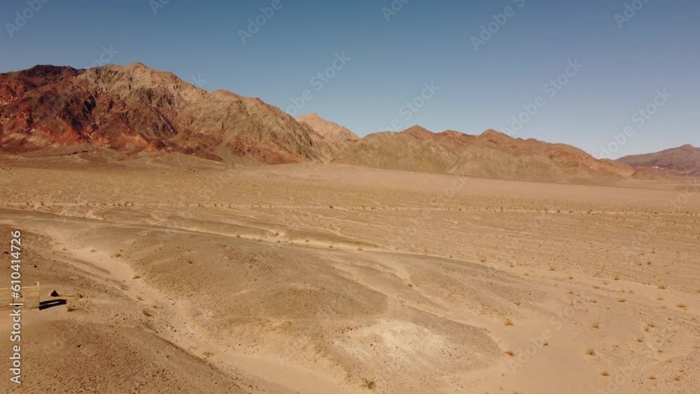 Desert of Death Valley (USA) from above shot by drone show dry geological area with mountains in background and old ruin building of the national park Desert of Death Valley (USA) from above shot by drone show dry geological area with mountains in background and old ruin building of the national park