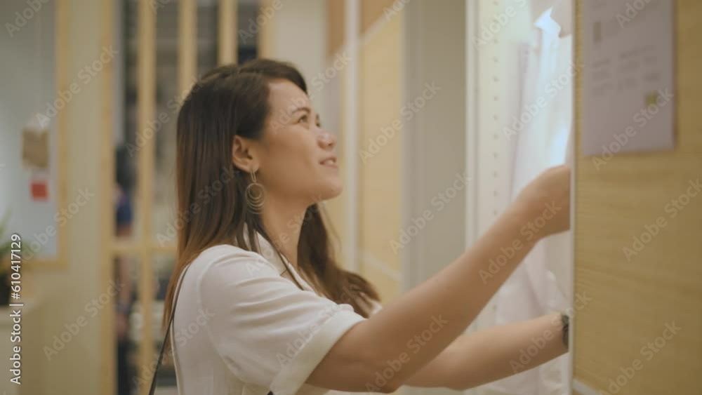 Shopping concept of 4k Resolution. Asian women are browsing the clothes inside a shopping mall. Shopping concept of 4k Resolution. Asian women are browsing the clothes inside a shopping mall.
