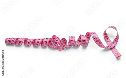 Pink tape measure on white background
