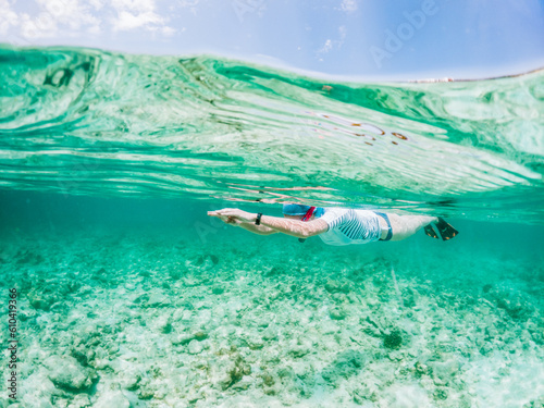 woman snorkeling in clear tropical sea © Melinda Nagy