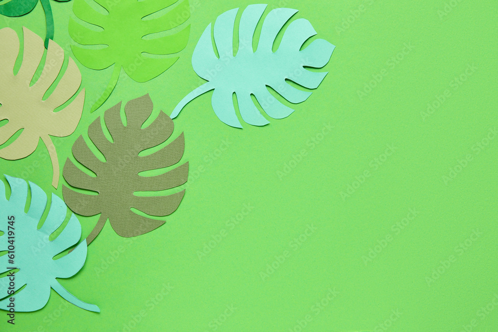 Different tropical leaves on green background Different tropical leaves on green background