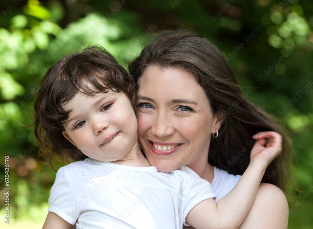 Outdoors portrait of mother and young daughter. Outdoors portrait of mother and young daughter.