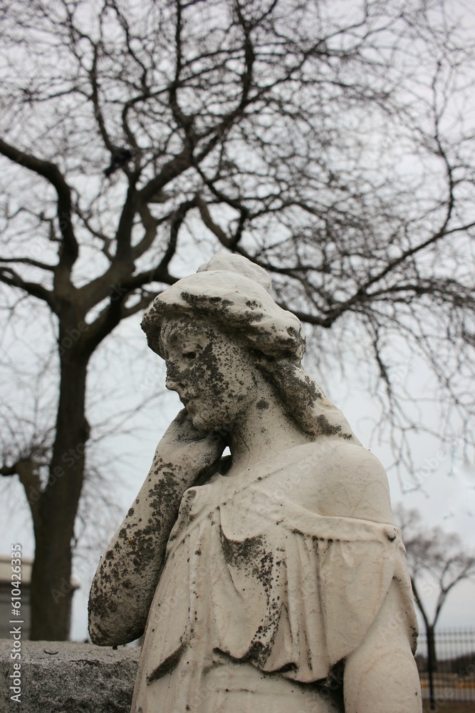 A statue of a sad angel