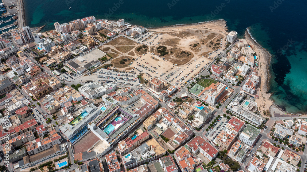 Aerial drone photo of the town of Sant Antoni de Portmany on the west coast of Ibiza, one of Spains Balearic Islands, showing hotels, apartments and businesses on the village on a sunny summers day