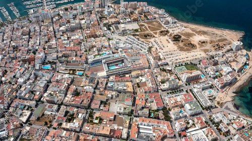 Straight down aerial drone photo of the town of Sant Antoni de Portmany on the west coast of Ibiza one of Spains Balearic Islands, showing hotels, apartments and businesses on the village in summer