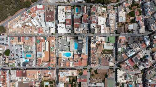 Straight down arial drone photo of the town of Sant Antoni de Portmany on the west coast of Ibiza one of Spains Balearic Islands, showing hotels, apartments and businesses on the village in the summer