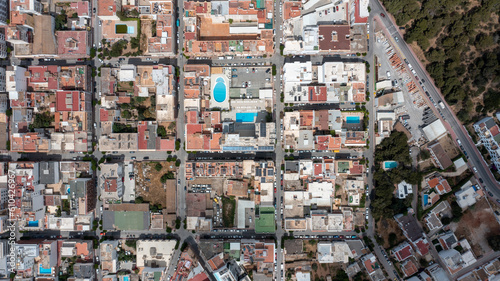 Straight down aerial drone photo of the town of Sant Antoni de Portmany on the west coast of Ibiza one of Spains Balearic Islands, showing hotels, apartments and businesses on the village in summer © Duncan
