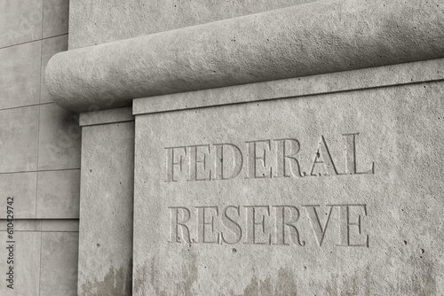 Retro style concrete wall engraved with the word FEDERAL RESERVE. Illustration of the concept of the issues and affairs related to federal reserve. photo