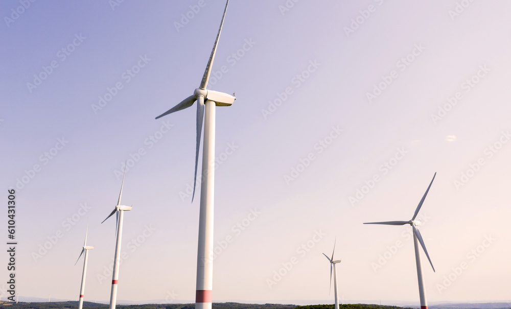 a modern wind turbine park in dusk a modern wind turbine park in dusk