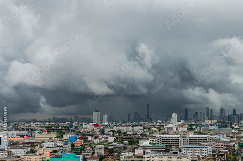 A heavy storm with rain and dramatic atmosphere clouds can be a sight to behold over a city center.