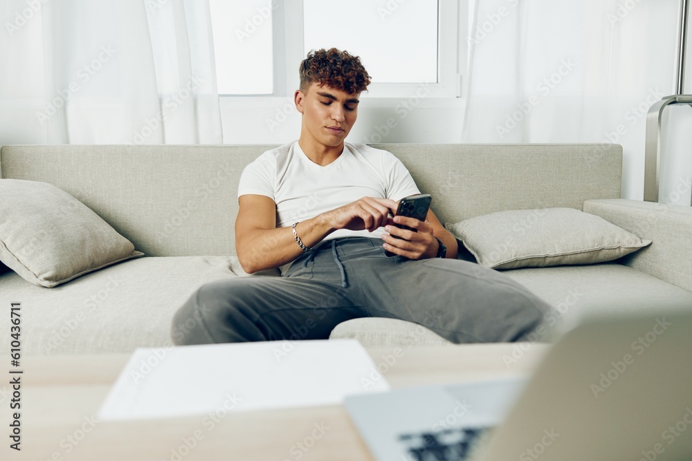 man interior young text message holding communication using lifestyle freelancer home person man interior young text message holding communication using lifestyle freelancer home person