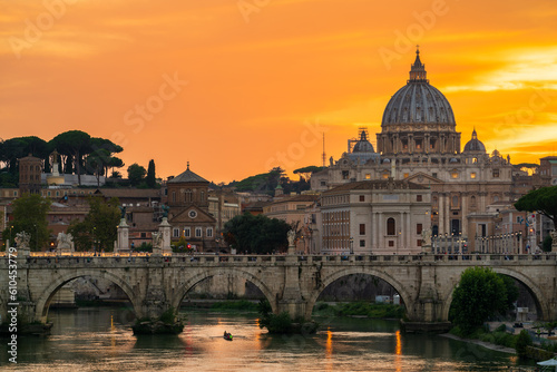 St. Peter's basilica across Tiber River canal at sunset in Rome, Italy © Pawel Pajor