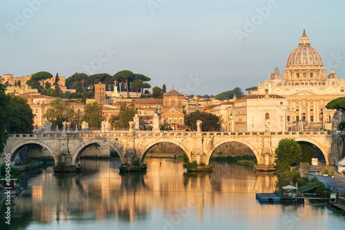 St. Peter's basilica and St. Angelo bridge at morning light in Vatican. Rome. Italy