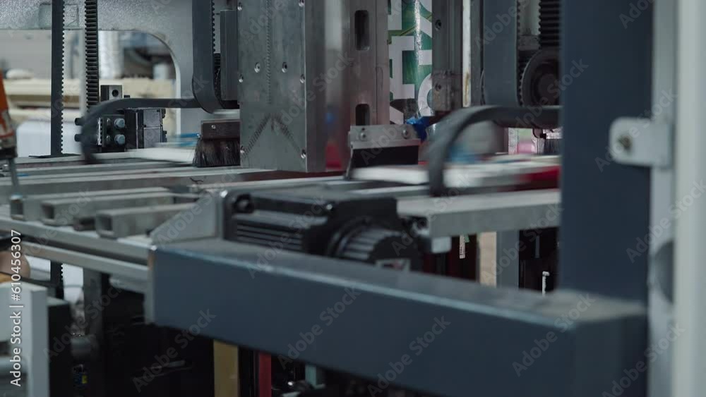 Automated Fabrication Machinery Pressing Fabric To Make Eco Shopping Bags. Fabrication Of Eco Grocery Bags By Heavy Industrial Equipment. Fabrication Of Red Eco Bags. Production Line. Conveyor Automated Fabrication Machinery Pressing Fabric To Make Eco Shopping Bags. Fabrication Of Eco Grocery Bags By Heavy Industrial Equipment. Fabrication Of Red Eco Bags. Production Line. Conveyor