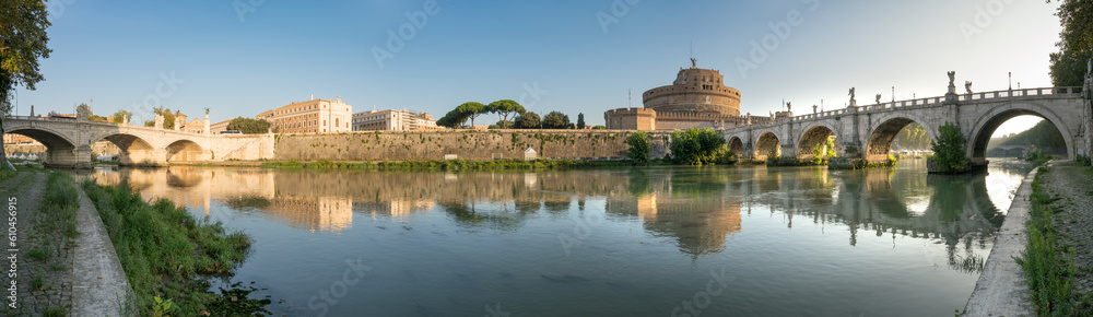Saint Angel Castle and bridge  panorama seen across Tiber river canal in Rome. Italy