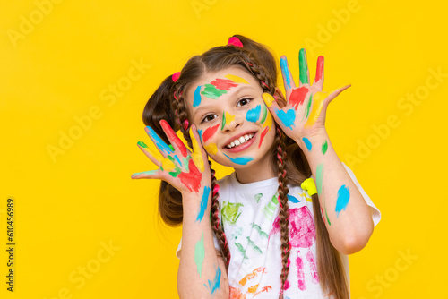 Children s creativity  a child is engaged in drawing  A funny little girl painted with colorful paints  Creativity and drawing for children.