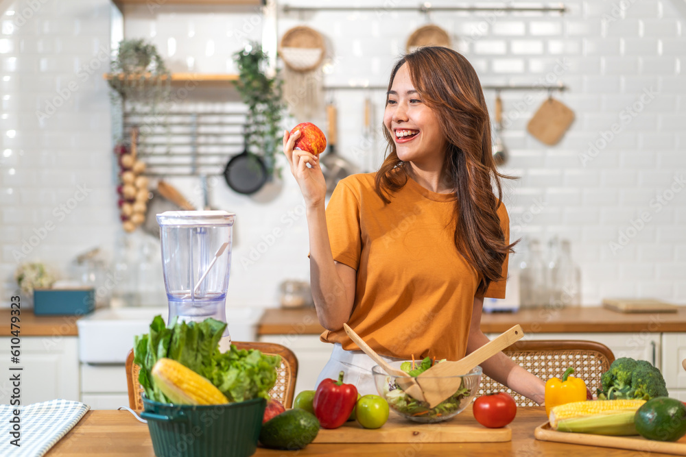 Portrait of beauty body slim healthy asian woman big smile cooking and preparing vegan food healthy holding apple, green apple, dental, teeth, fruit in kitchen at home.Diet.Fitness, healthy food - obrazy, fototapety, plakaty 