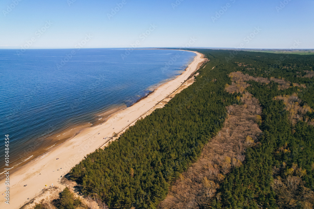 Forest Landscape AERIAL view drone with sandy beach of Baltic Sea in Poland green forest. Nature reserve on Sobieszewo island in Gdansk Poland