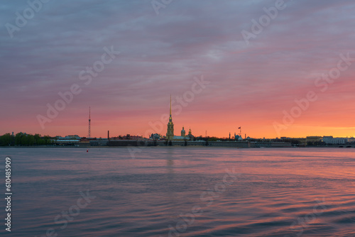 View of the Peter and Paul Fortress and the Neva River against a pink dawn sky with clouds on a sunny spring morning, St. Petersburg, Russia © Ula Ulachka