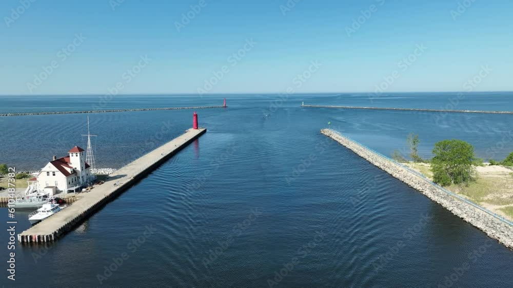 Slow movement pulling backward over the Muskegon Channel while facing out to Lake Michigan.